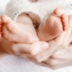 Photo of a tiny Newborn Baby's feet on female Heart Shaped hands