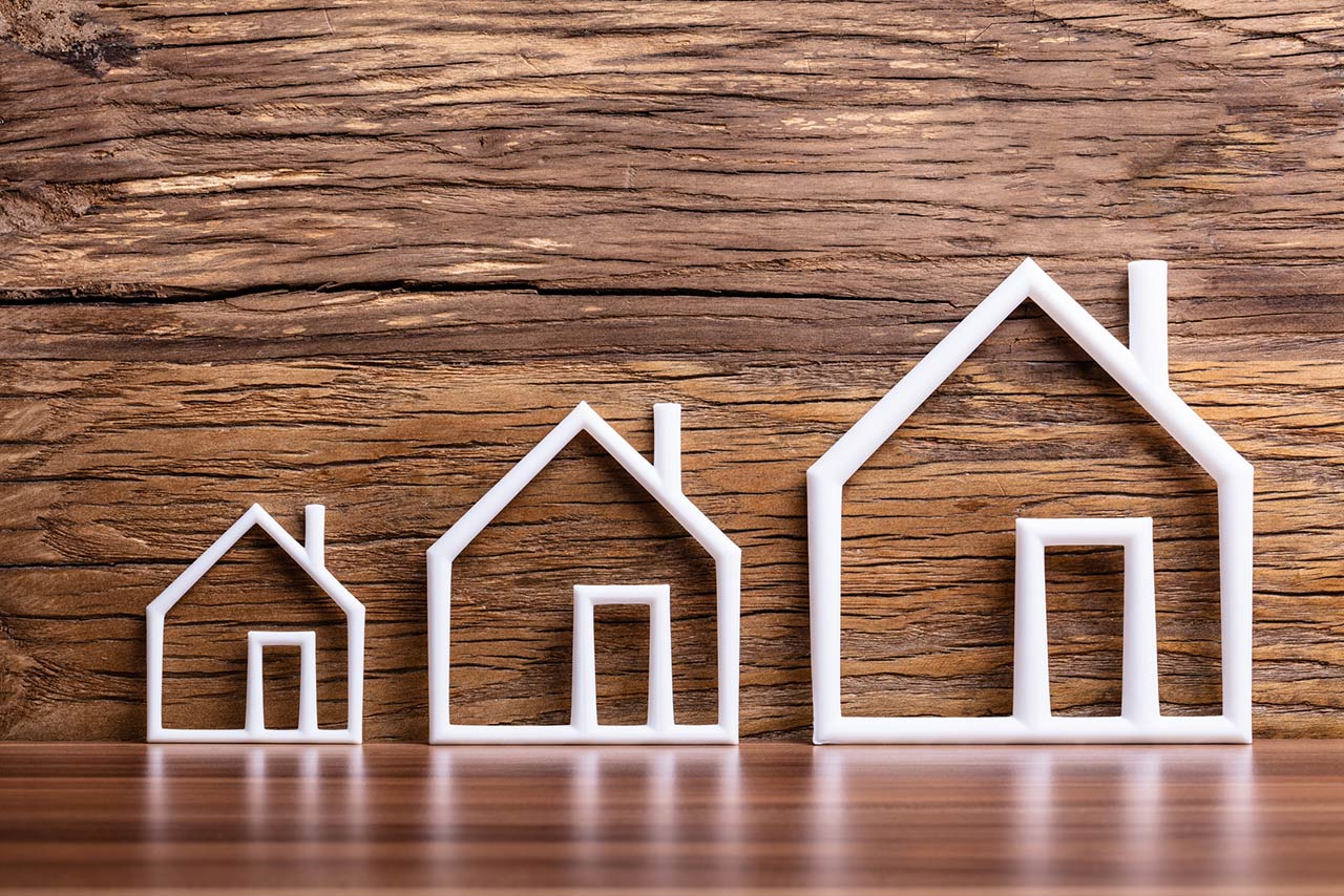 Increasing White Outlined Houses Against Rustic Background