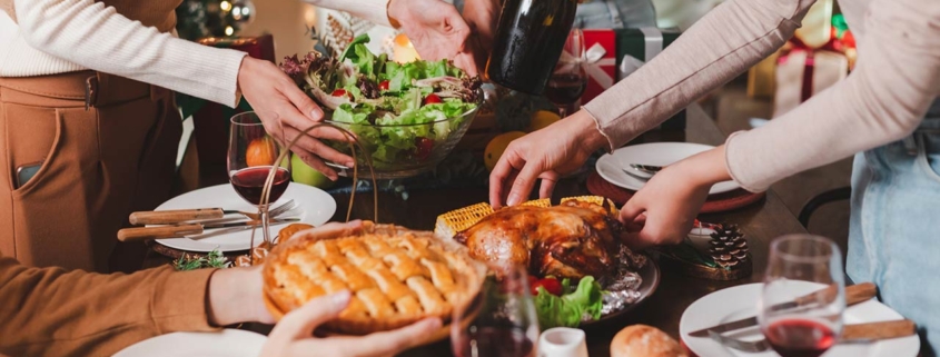 Group of young adult Asian Friends holiday party dinner at home around the table
