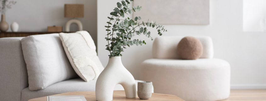 Chair with pillow, coffee table, vase in a living room stock photo